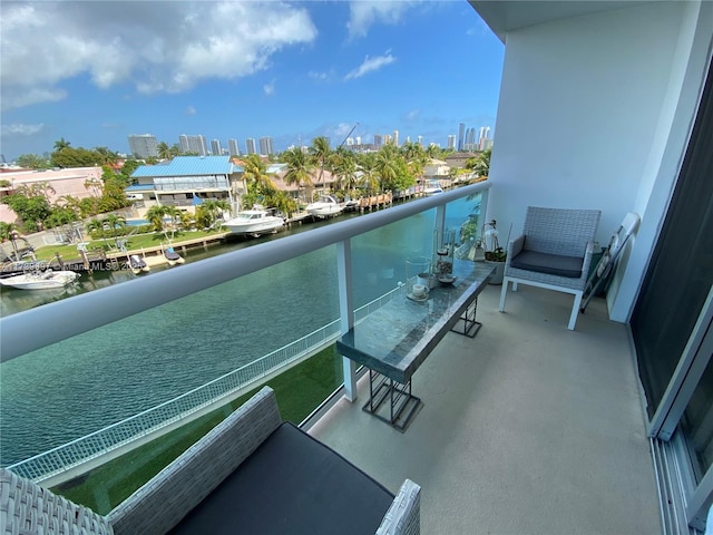 balcony with a water view and a city view