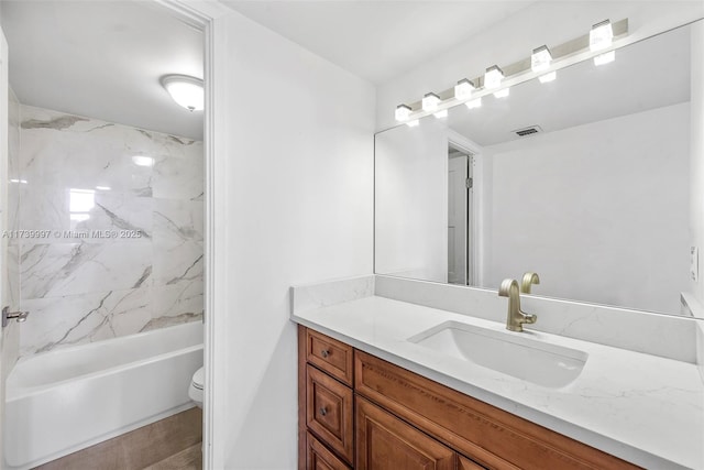 bathroom with  shower combination, visible vents, vanity, and toilet