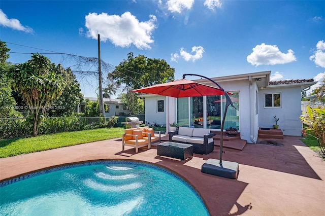 rear view of property with an outdoor hangout area and a patio