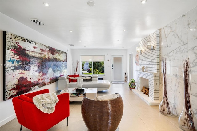 living room with light tile patterned flooring and a fireplace