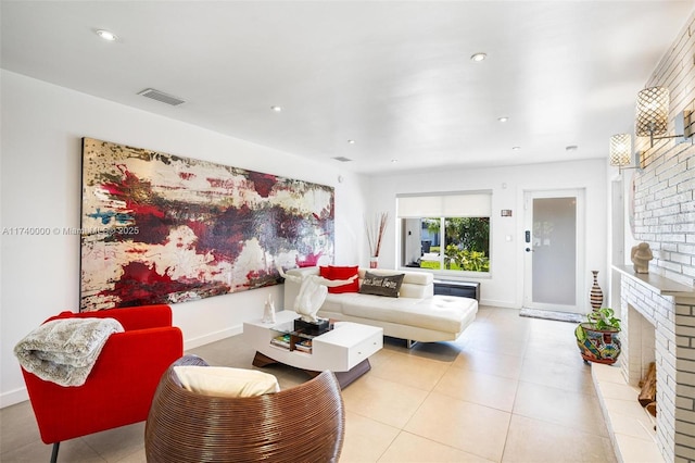 living room featuring light tile patterned floors and a fireplace