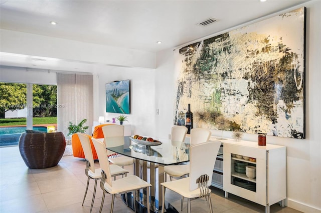 dining area with light tile patterned floors