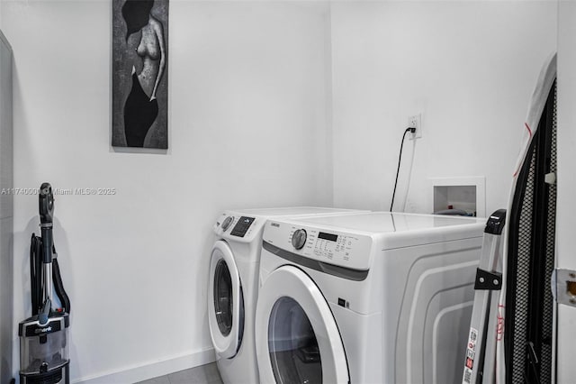 washroom with washer and dryer