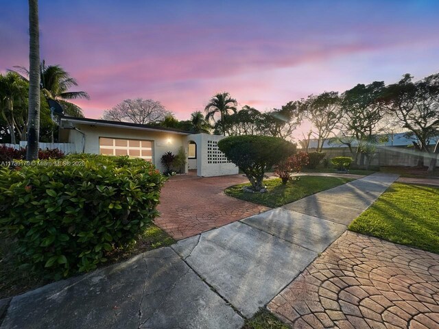 ranch-style home featuring a garage