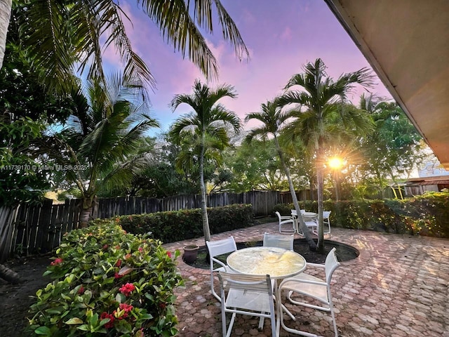 view of patio terrace at dusk