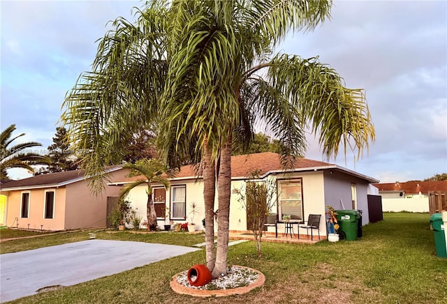 exterior space featuring a lawn and a patio