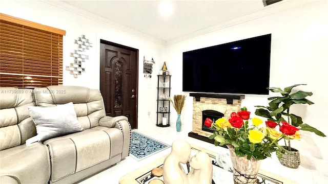 living room with crown molding and a fireplace