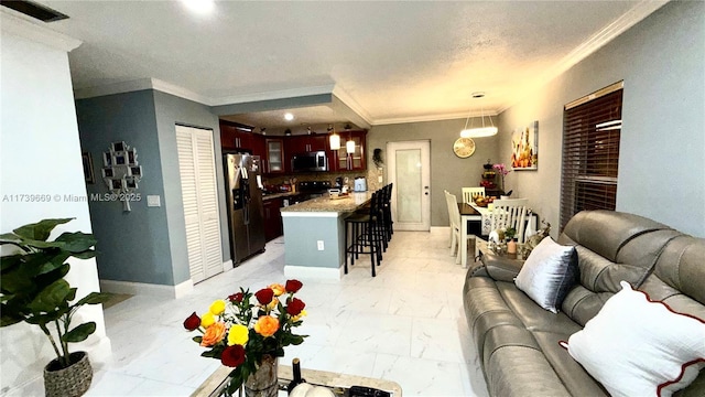 living room featuring ornamental molding and a textured ceiling