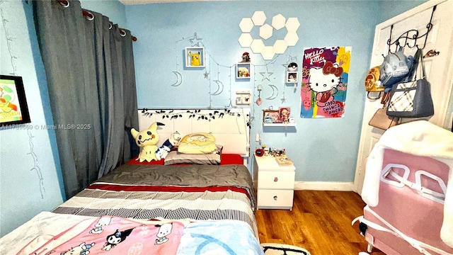 bedroom with dark wood-type flooring