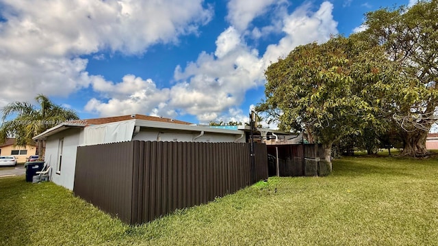 view of property exterior with a yard