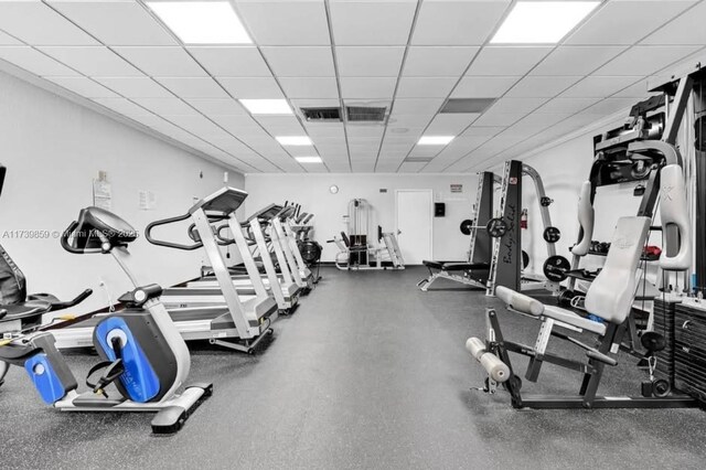 gym featuring a paneled ceiling