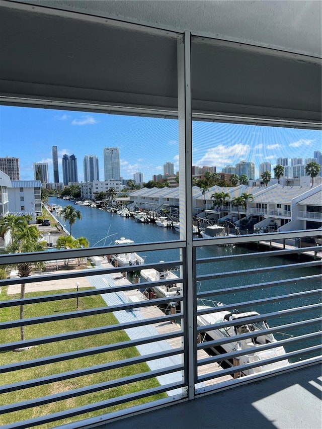 balcony featuring a water view