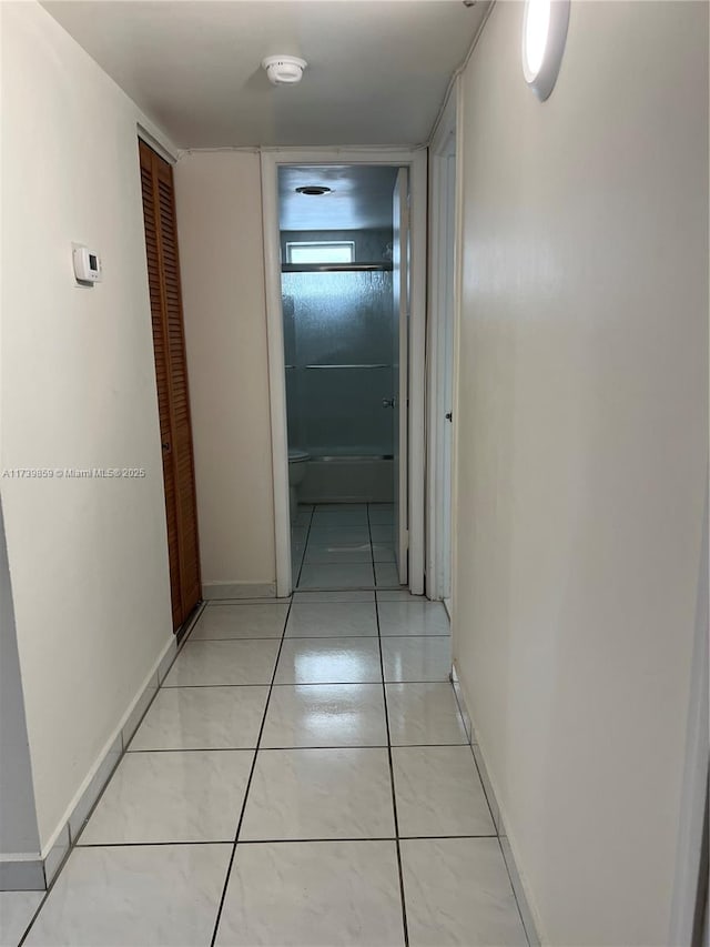 corridor with light tile patterned floors