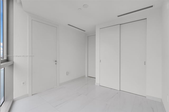 unfurnished bedroom featuring a closet