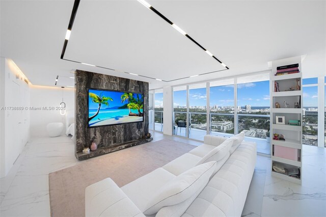 living room featuring a wall of windows