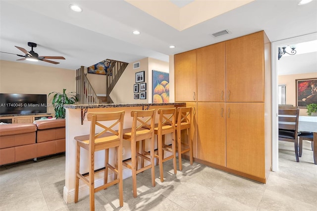 bar with ceiling fan, a dry bar, visible vents, and recessed lighting