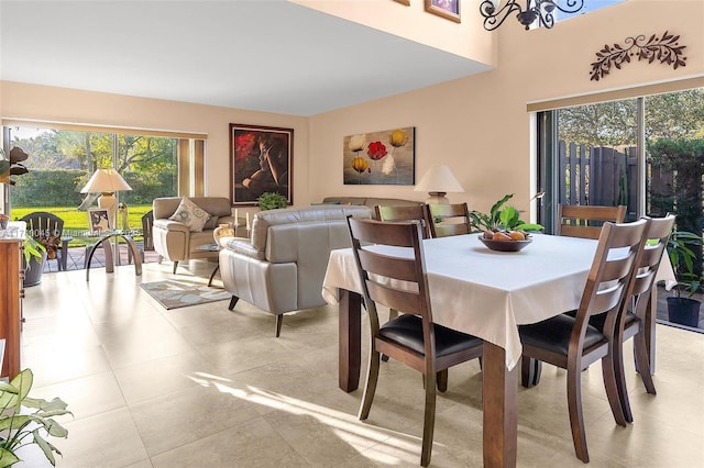 dining space featuring light tile patterned floors