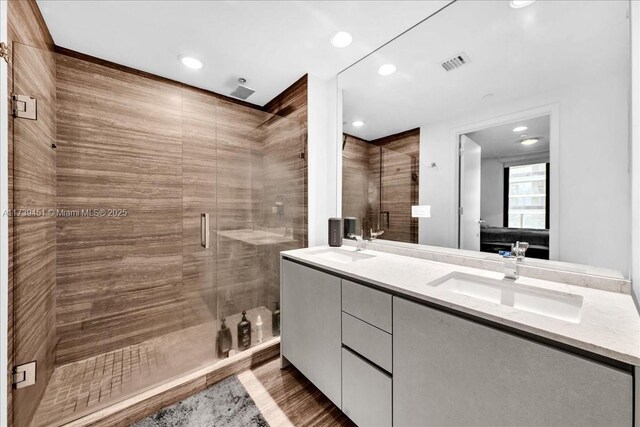 interior space featuring a tray ceiling and light hardwood / wood-style floors