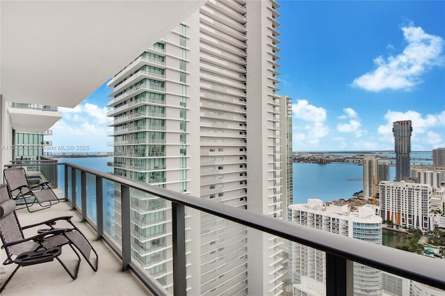 balcony featuring a water view