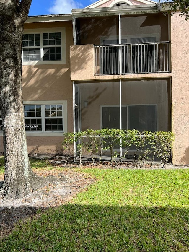 620 Cypress Club Way Unit I13, Deerfield Beach, FL 33064 - back of property featuring a balcony and stucco siding