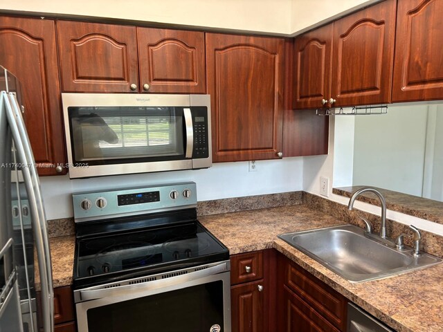 620 Cypress Club Way Unit I13, Deerfield Beach, FL 33064 - kitchen with appliances with stainless steel finishes and a sink