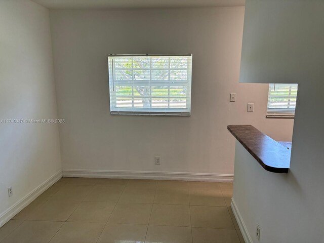 620 Cypress Club Way Unit I13, Deerfield Beach, FL 33064 - unfurnished room featuring baseboards and light tile patterned floors