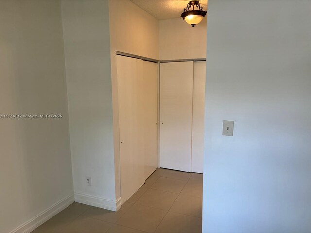 620 Cypress Club Way Unit I13, Deerfield Beach, FL 33064 - hall featuring light tile patterned flooring and baseboards