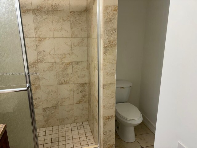 620 Cypress Club Way Unit I13, Deerfield Beach, FL 33064 - full bathroom featuring a shower stall, toilet, and tile patterned floors