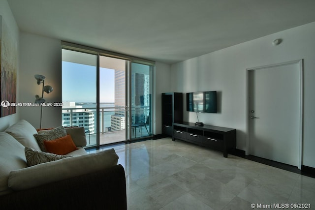 living room featuring a wall of windows