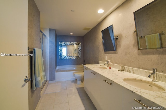 full bathroom featuring vanity, tile patterned floors, toilet, and separate shower and tub