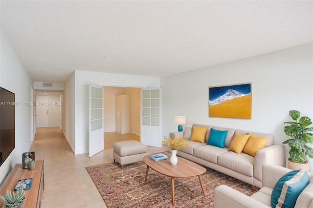 living room with a textured ceiling