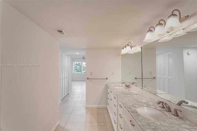 bathroom featuring ceiling fan, tile patterned floors, and vanity