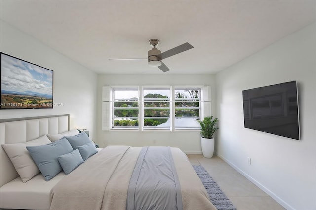 bedroom featuring light tile patterned floors and ceiling fan