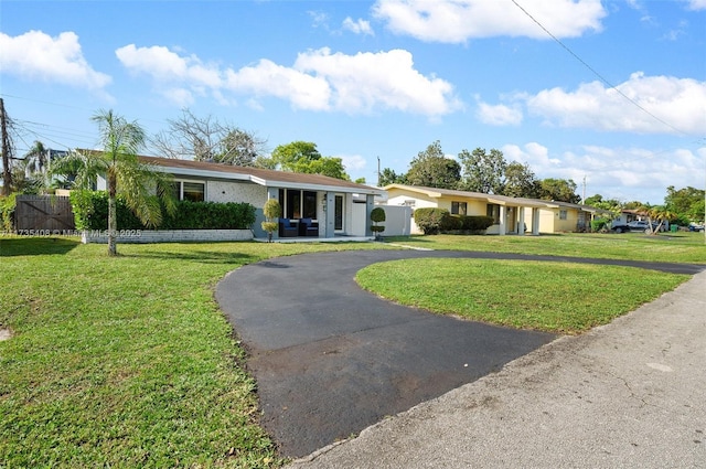 ranch-style home with a front yard