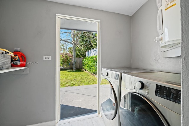 washroom featuring washer and dryer