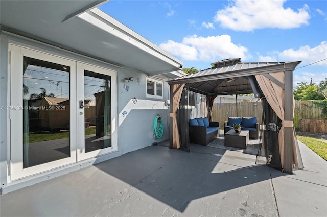 view of patio / terrace featuring a gazebo, outdoor lounge area, and french doors