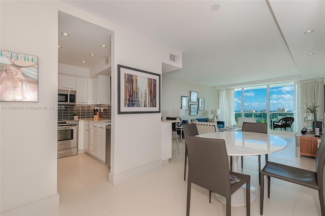 dining room with a wall of windows