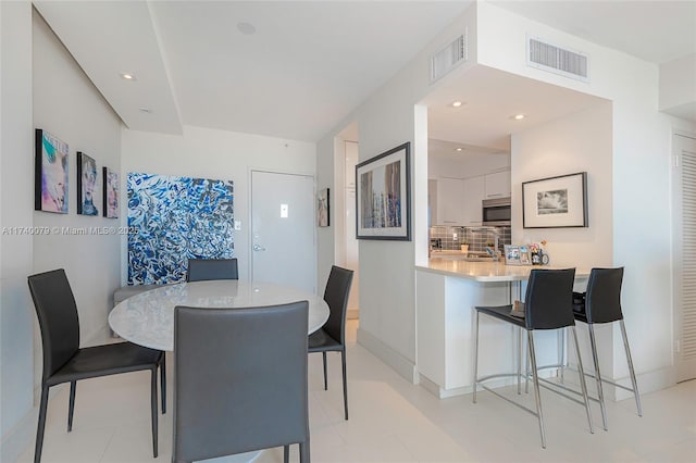 dining room featuring sink