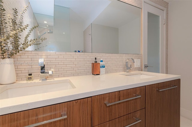 bathroom featuring vanity and decorative backsplash