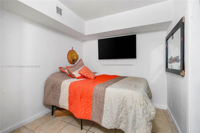 bedroom featuring tile patterned flooring