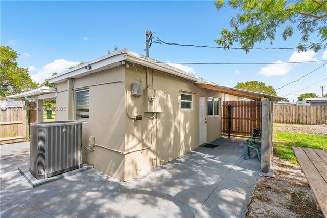 view of property exterior featuring a patio and central air condition unit