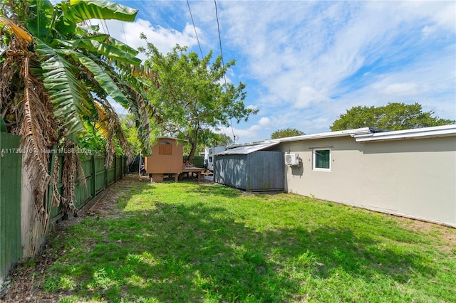 view of yard with a storage unit