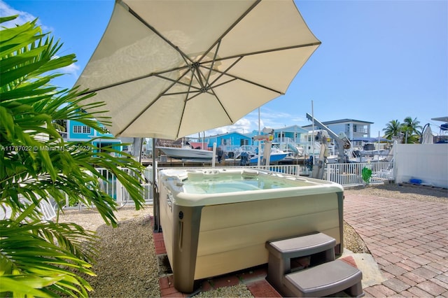 view of patio / terrace with a hot tub