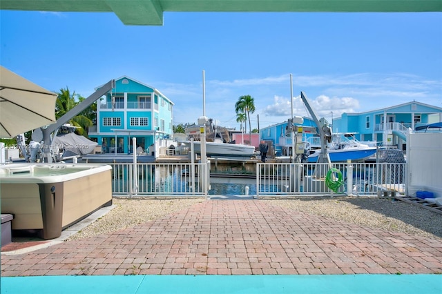 exterior space with a boat dock and a water view