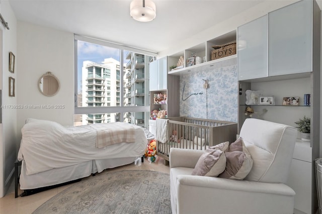 bedroom with floor to ceiling windows