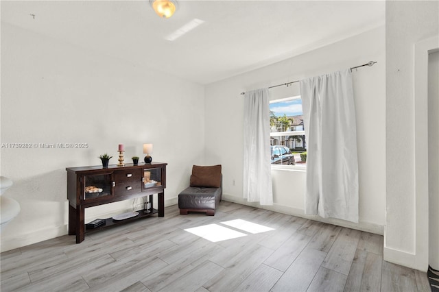 sitting room featuring light wood-type flooring