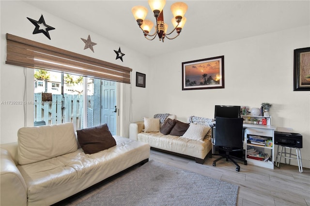 living room with hardwood / wood-style floors and a chandelier