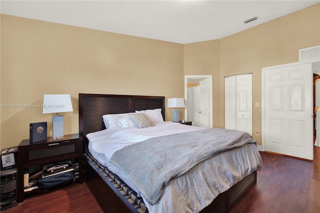 bedroom with dark wood-type flooring