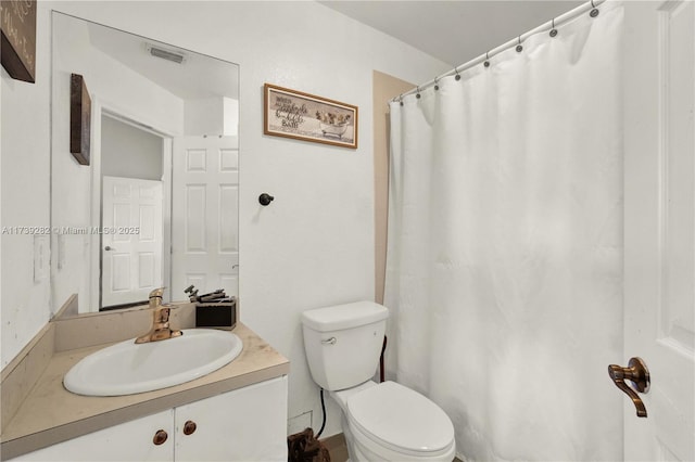 bathroom featuring vanity, a shower with curtain, and toilet