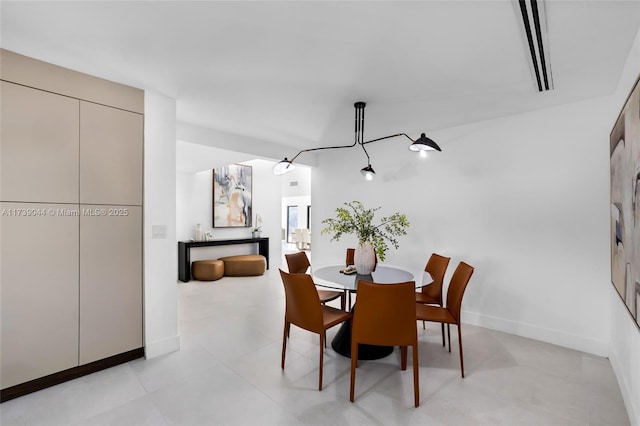 dining room featuring baseboards